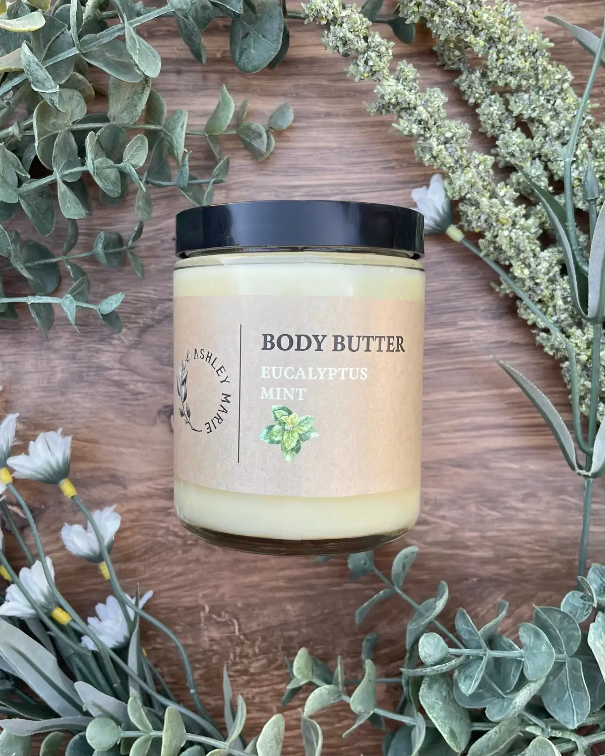 Body Butter photographed on wood with dried flowers