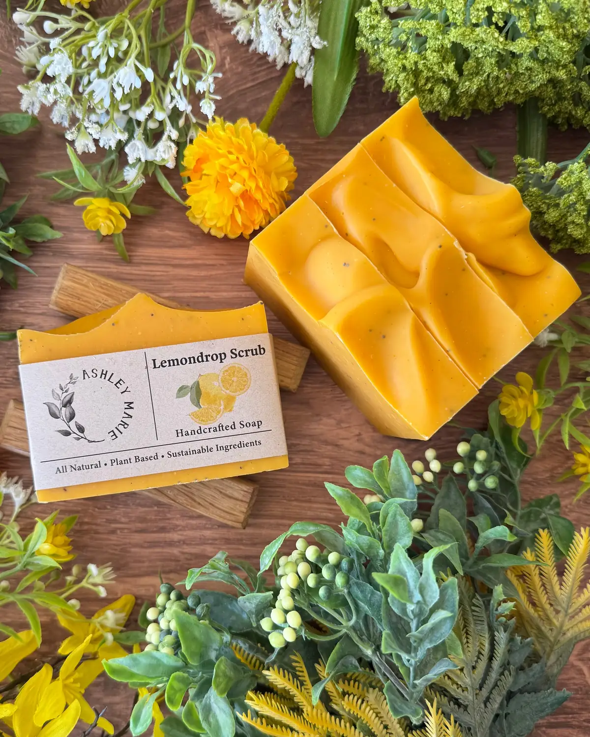 Lemondrop Scrub Soap photographed on wood with dried flowers