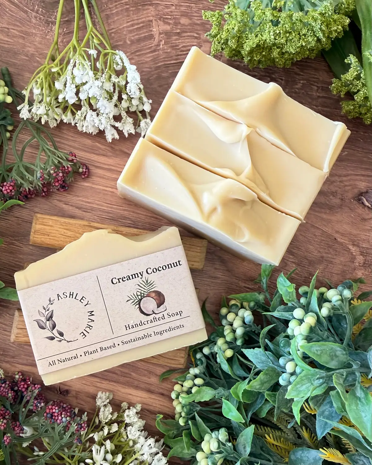 Creamy Coconut Soap photographed on wood with dried flowers