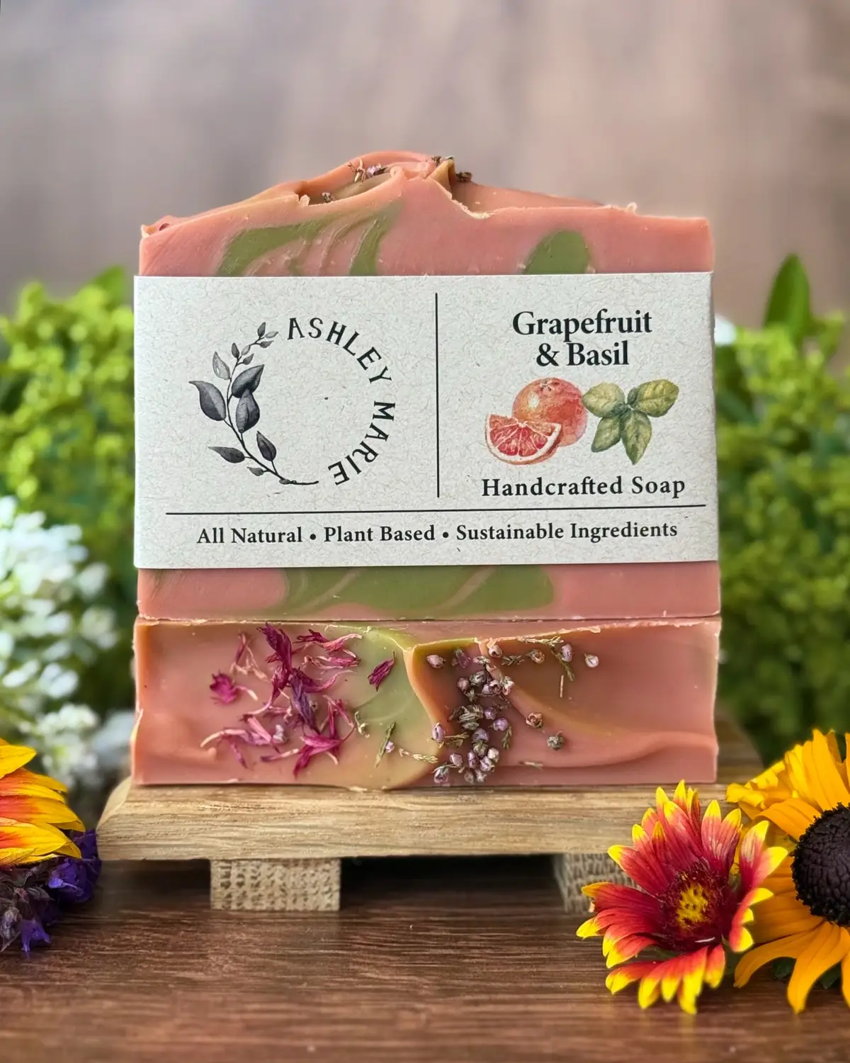 Grapefruit & Basil Soap photographed on wood with dried flowers