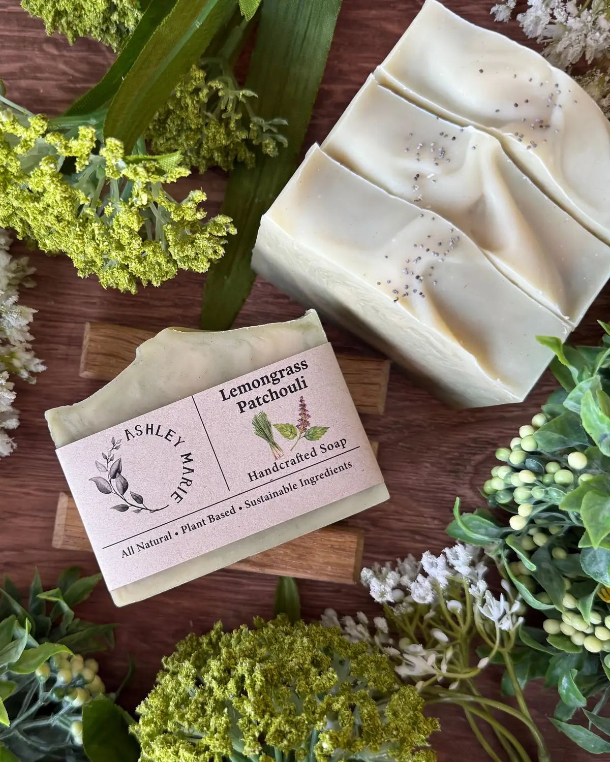 Lemongrass Patchouli Soap photographed on wood with dried flowers