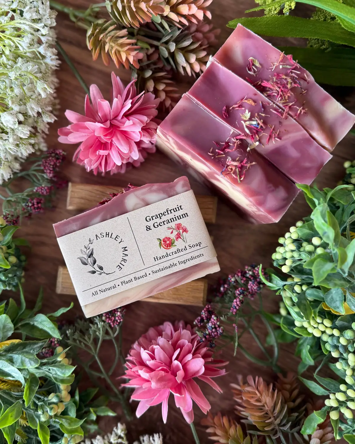 Grapefruit & Geranium Soap photographed on wood with dried flowers