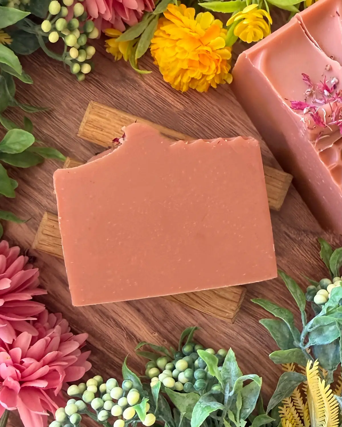 A cut bar of wildflower honey soap showing the swirl